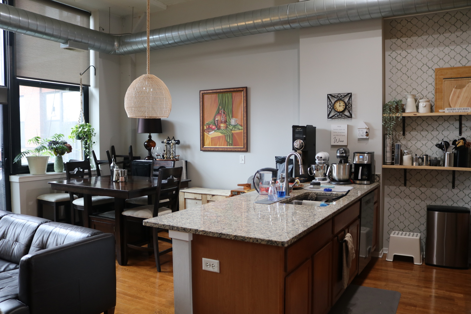 2323 West Pershing Road, Unit 319 Chicago, IL 60609 - Photo 12 of 39 a kitchen with granite countertop a sink a stove and a dining table