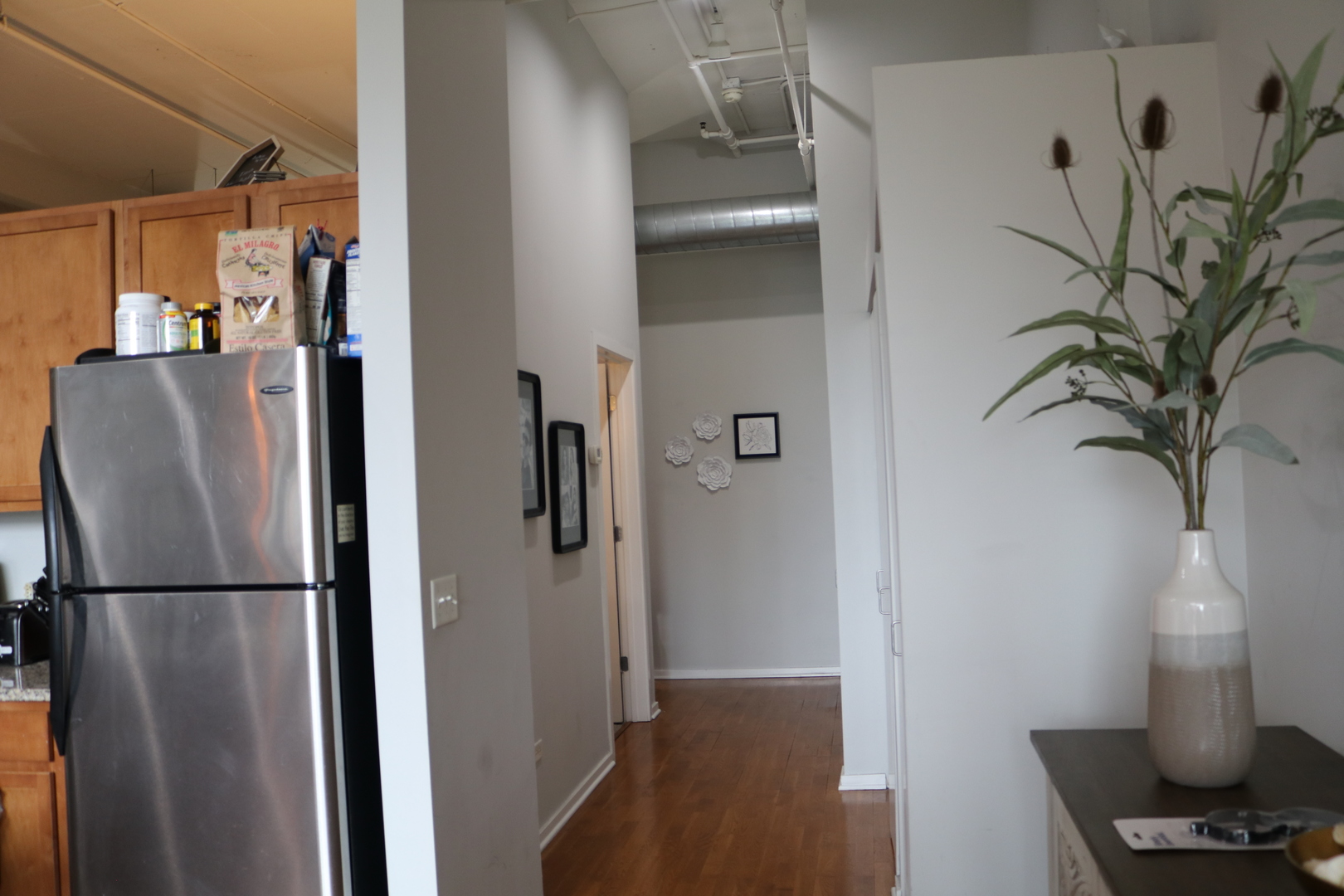 2323 West Pershing Road, Unit 319 Chicago, IL 60609 - Photo 14 of 39 a view of a kitchen from a hallway