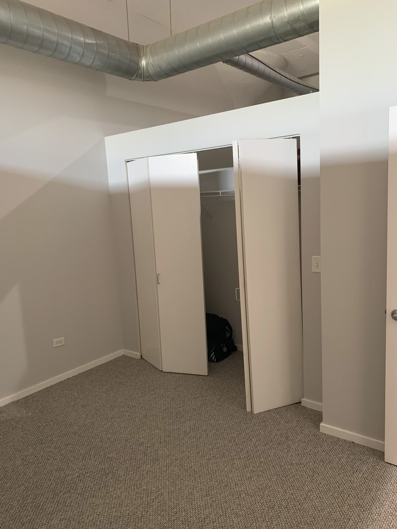 2323 West Pershing Road, Unit 319 Chicago, IL 60609 - Photo 16 of 39 a view of empty room