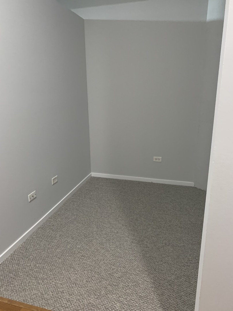 2323 West Pershing Road, Unit 319 Chicago, IL 60609 - Photo 23 of 39 a room that has a window in it