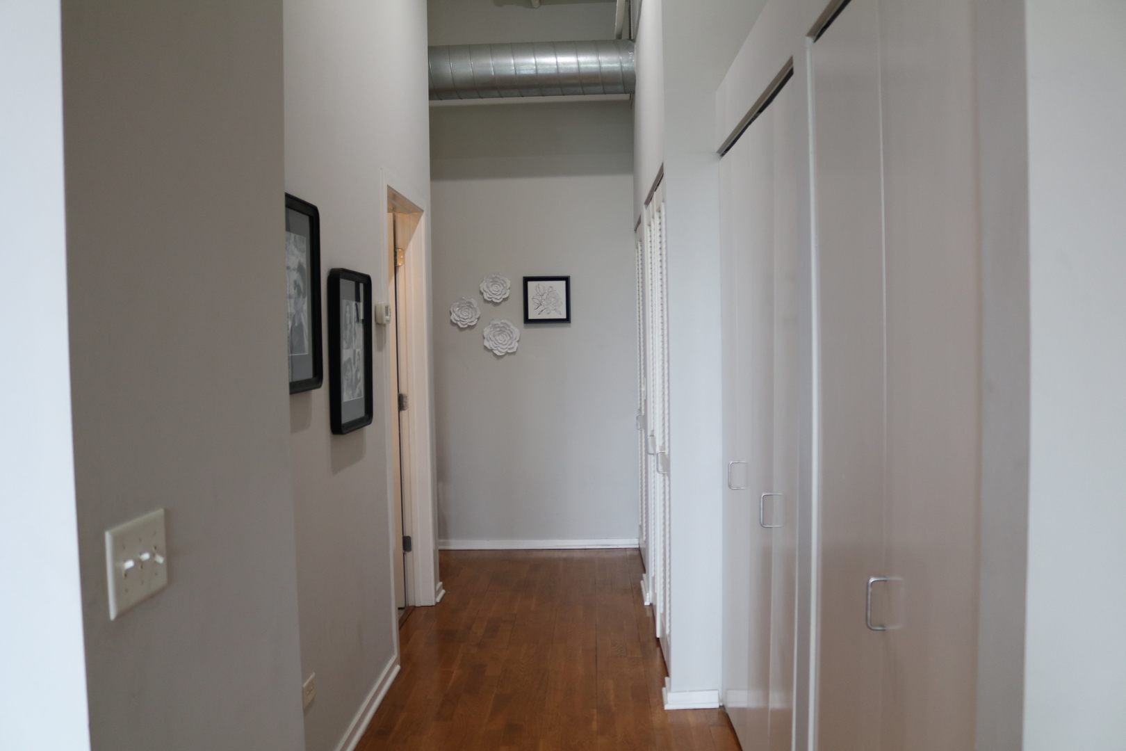 2323 West Pershing Road, Unit 319 Chicago, IL 60609 - Photo 26 of 39 a view of a hallway with wooden floor and staircase