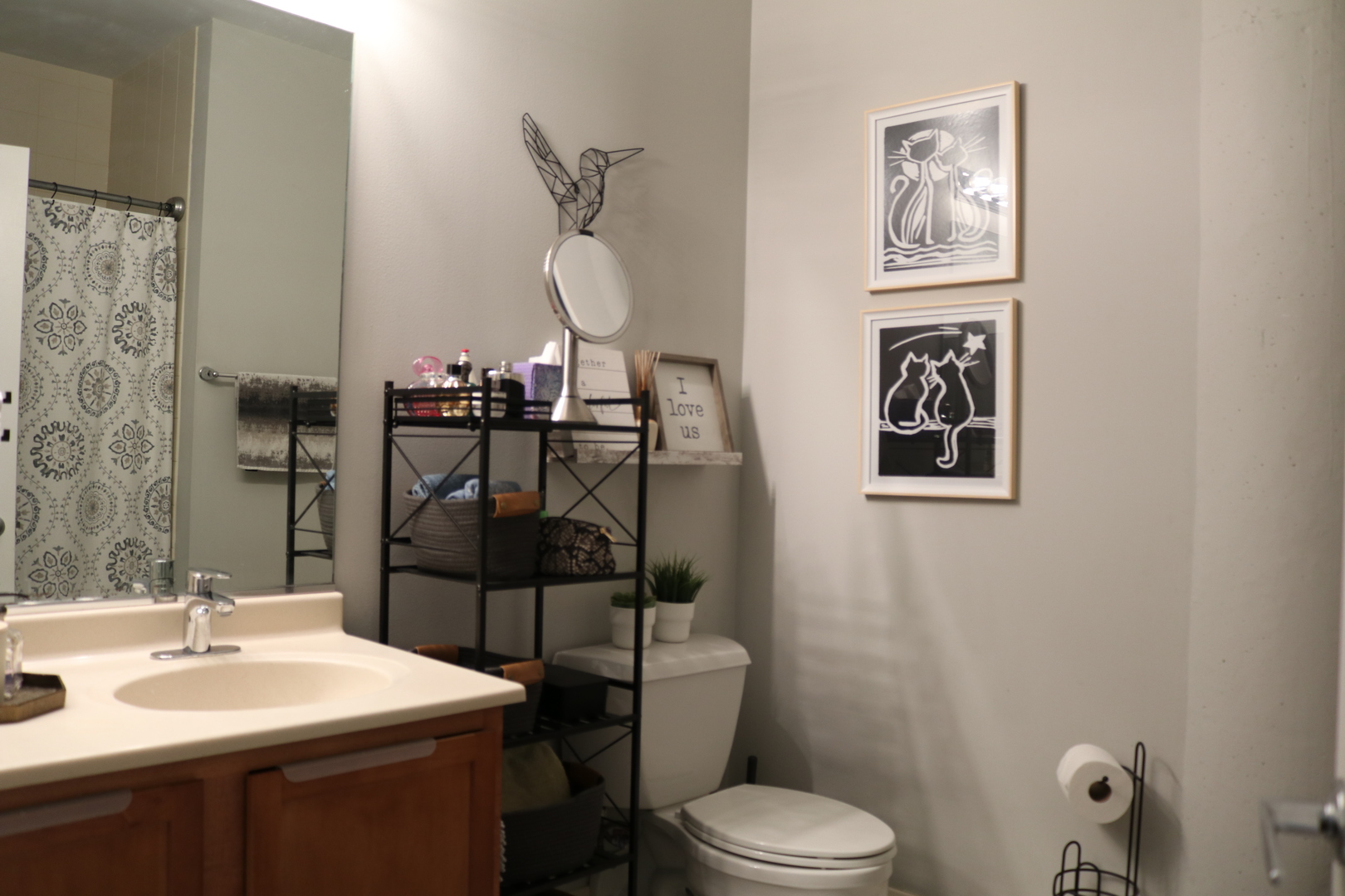 2323 West Pershing Road, Unit 319 Chicago, IL 60609 - Photo 30 of 39 a bathroom with a toilet sink and mirror