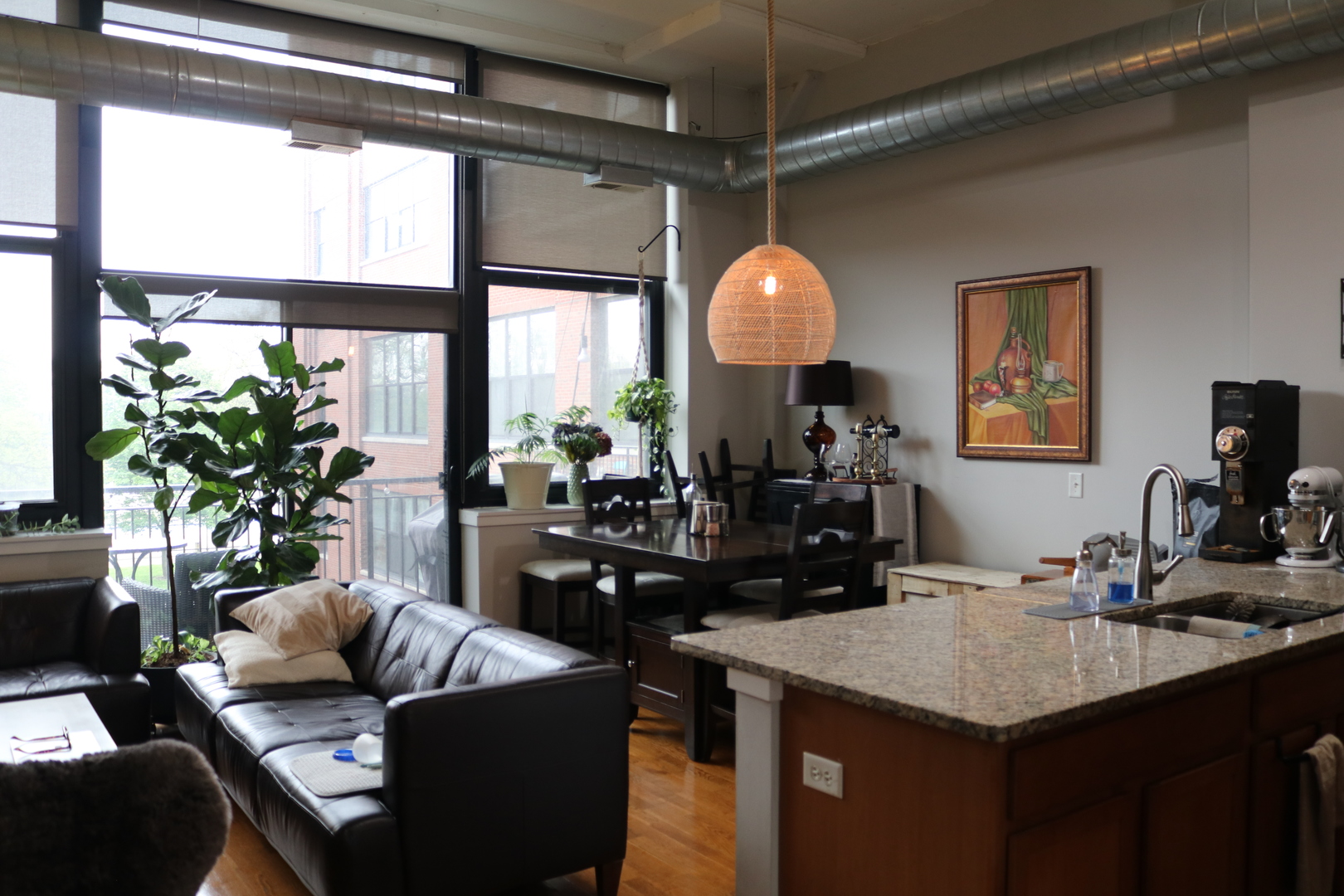 2323 West Pershing Road, Unit 319 Chicago, IL 60609 - Photo 3 of 39 a kitchen with a table chairs refrigerator and sink