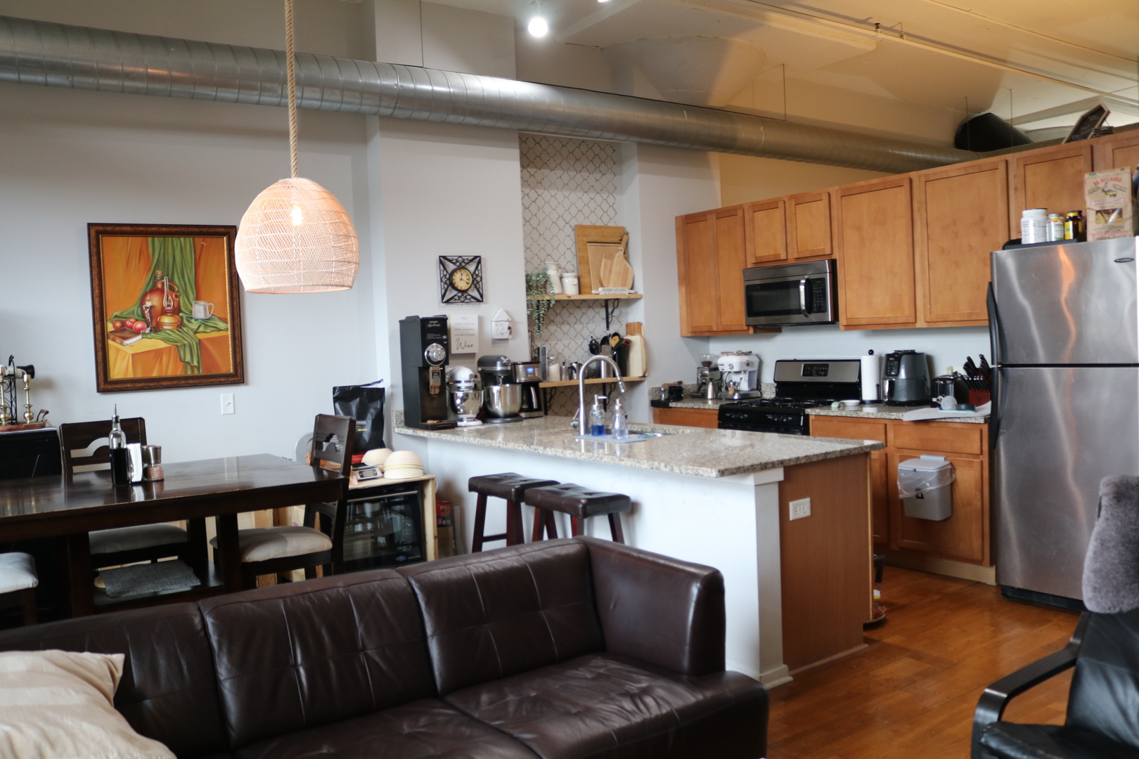 2323 West Pershing Road, Unit 319 Chicago, IL 60609 - Photo 5 of 39 a living room with stainless steel appliances furniture a fireplace a flat screen tv and a window