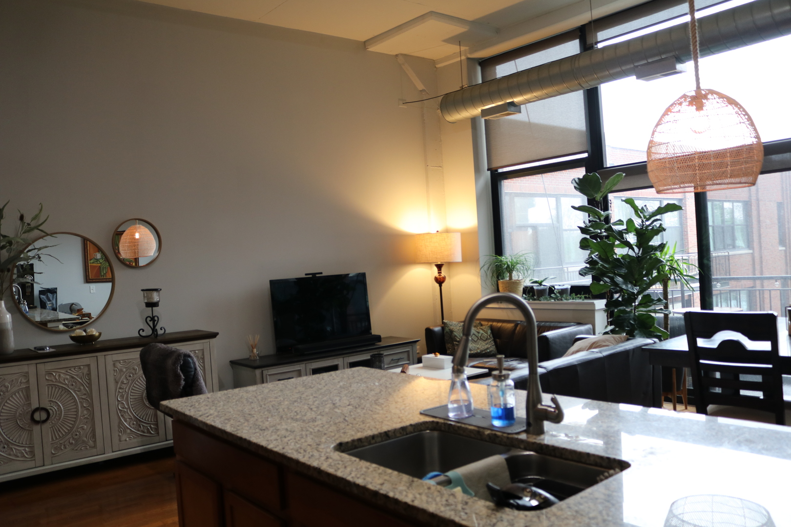 2323 West Pershing Road, Unit 319 Chicago, IL 60609 - Photo 6 of 39 a kitchen with a sink and a stove next to a window