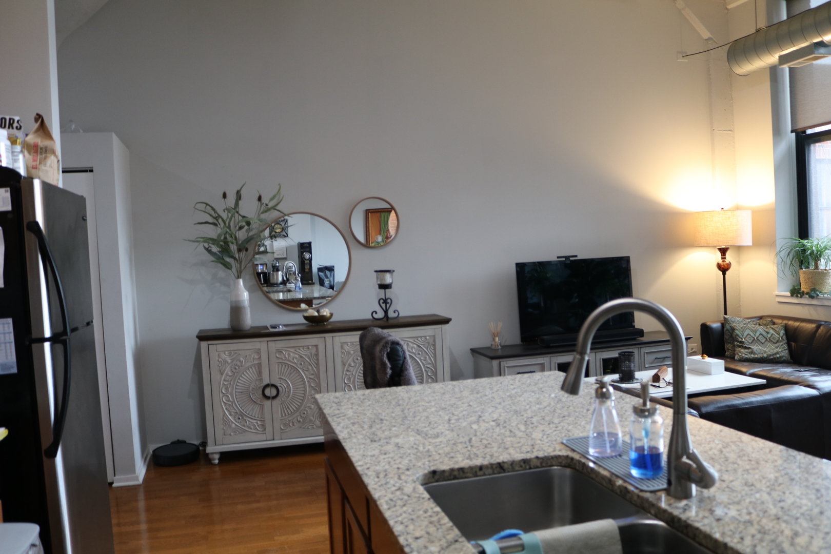 2323 West Pershing Road, Unit 319 Chicago, IL 60609 - Photo 8 of 39 a kitchen with sink refrigerator and stove