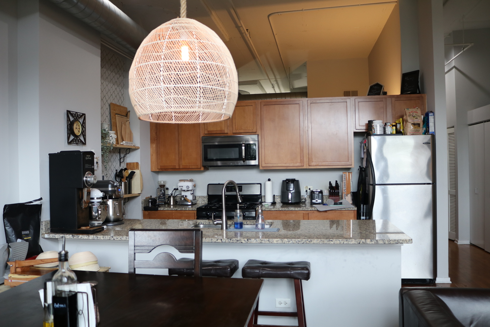 2323 West Pershing Road, Unit 319 Chicago, IL 60609 - Photo 9 of 39 a kitchen with stainless steel appliances granite countertop a sink refrigerator and cabinets