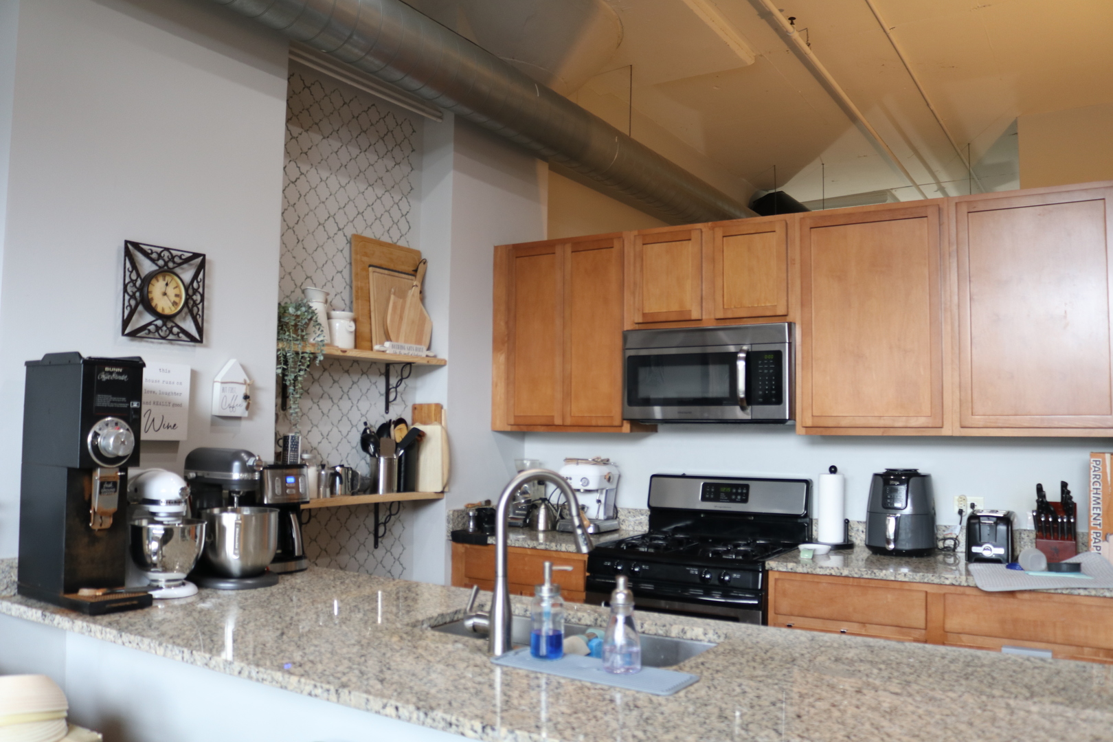 2323 West Pershing Road, Unit 319 Chicago, IL 60609 - Photo 10 of 39 a kitchen with stainless steel appliances granite countertop a stove and a sink