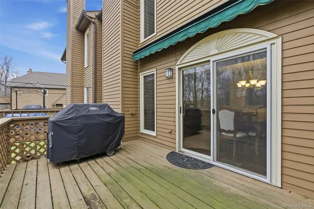 a view of a house with a large window and wooden floor