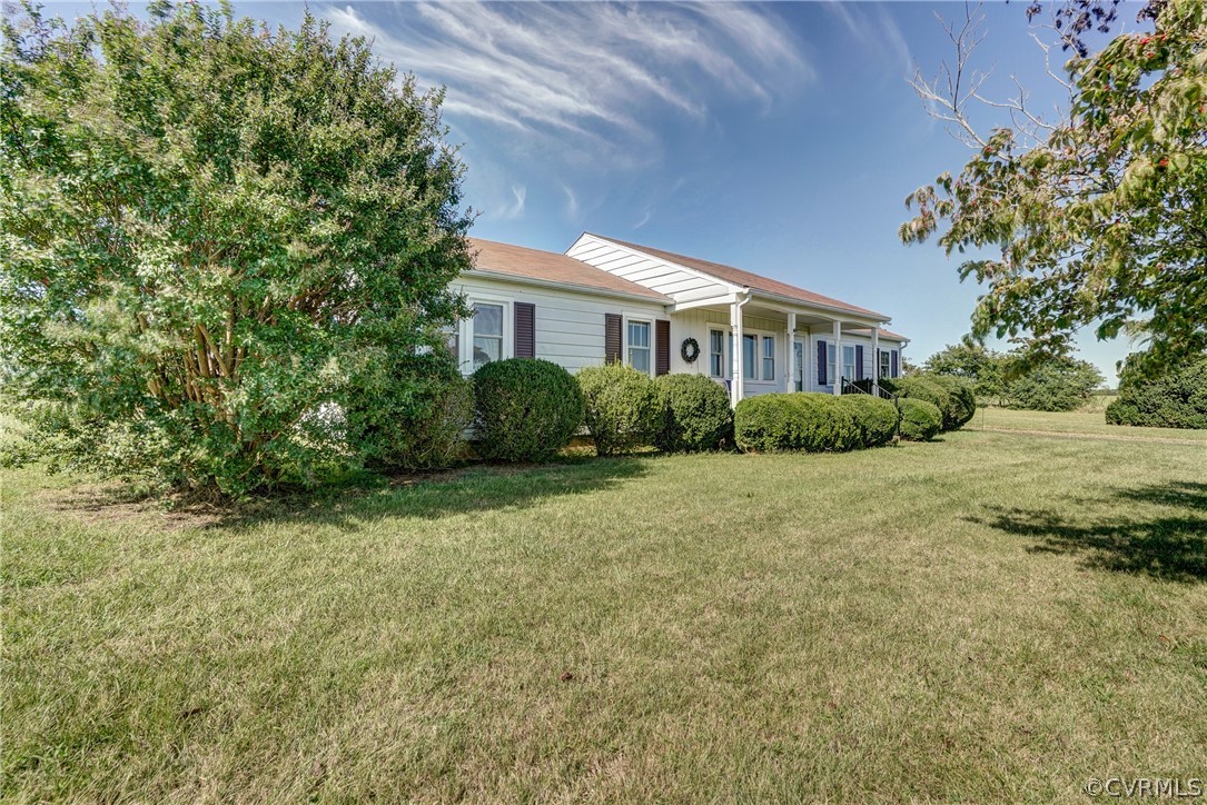 121 John Randolph Road Farmville, VA 23901 - Photo 26 of 46 a front view of a house with a garden