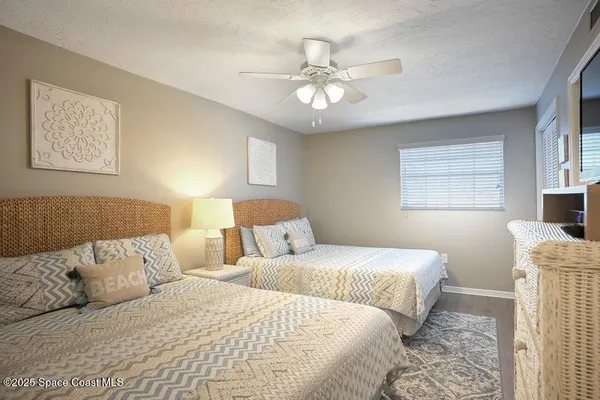 a bedroom with a bed and lamp with window