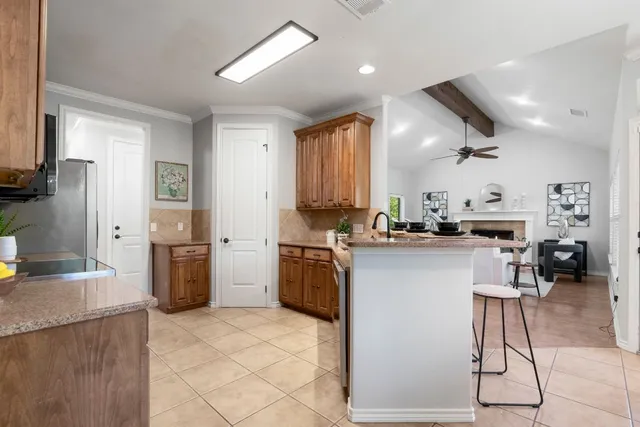 a kitchen with a sink cabinets and stainless steel appliances