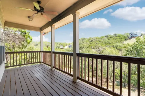 a view of a balcony with wooden floor