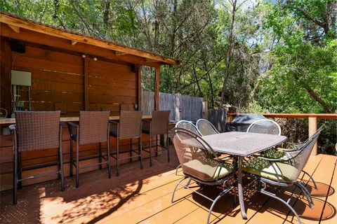 a balcony with table and chairs