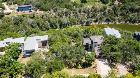 an aerial view of house with yard swimming pool and outdoor seating