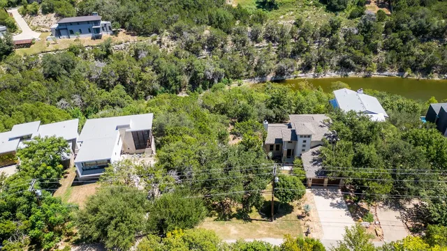 an aerial view of house with yard swimming pool and outdoor seating