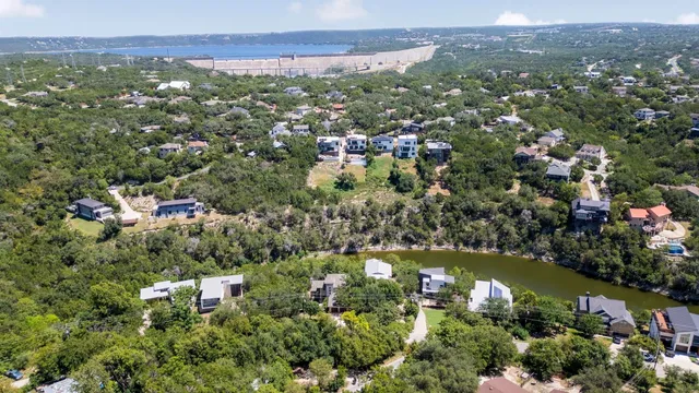 an aerial view of residential house with outdoor space and trees around