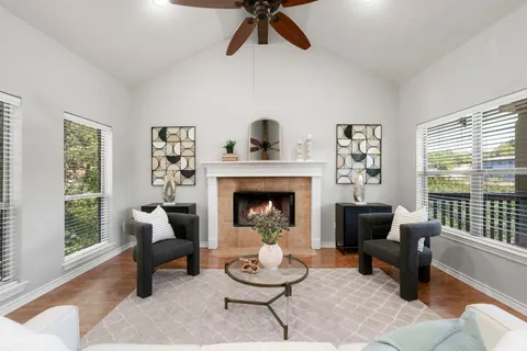 a living room with furniture and a fireplace