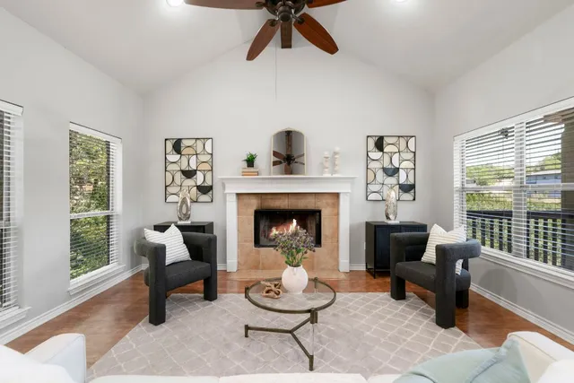 a living room with furniture and a fireplace