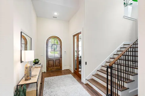 a view of an entryway with wooden floor