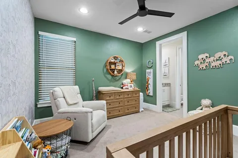 a bedroom with furniture and a window