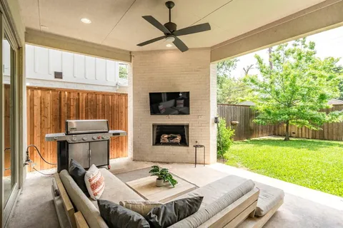 a open kitchen with a table chairs and a fireplace
