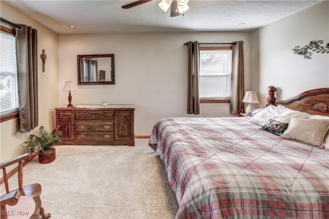 4234 Grafton Road Brunswick, OH 44212 - Photo 14 of 40 Carpeted bedroom with ceiling fan and a textured ceiling