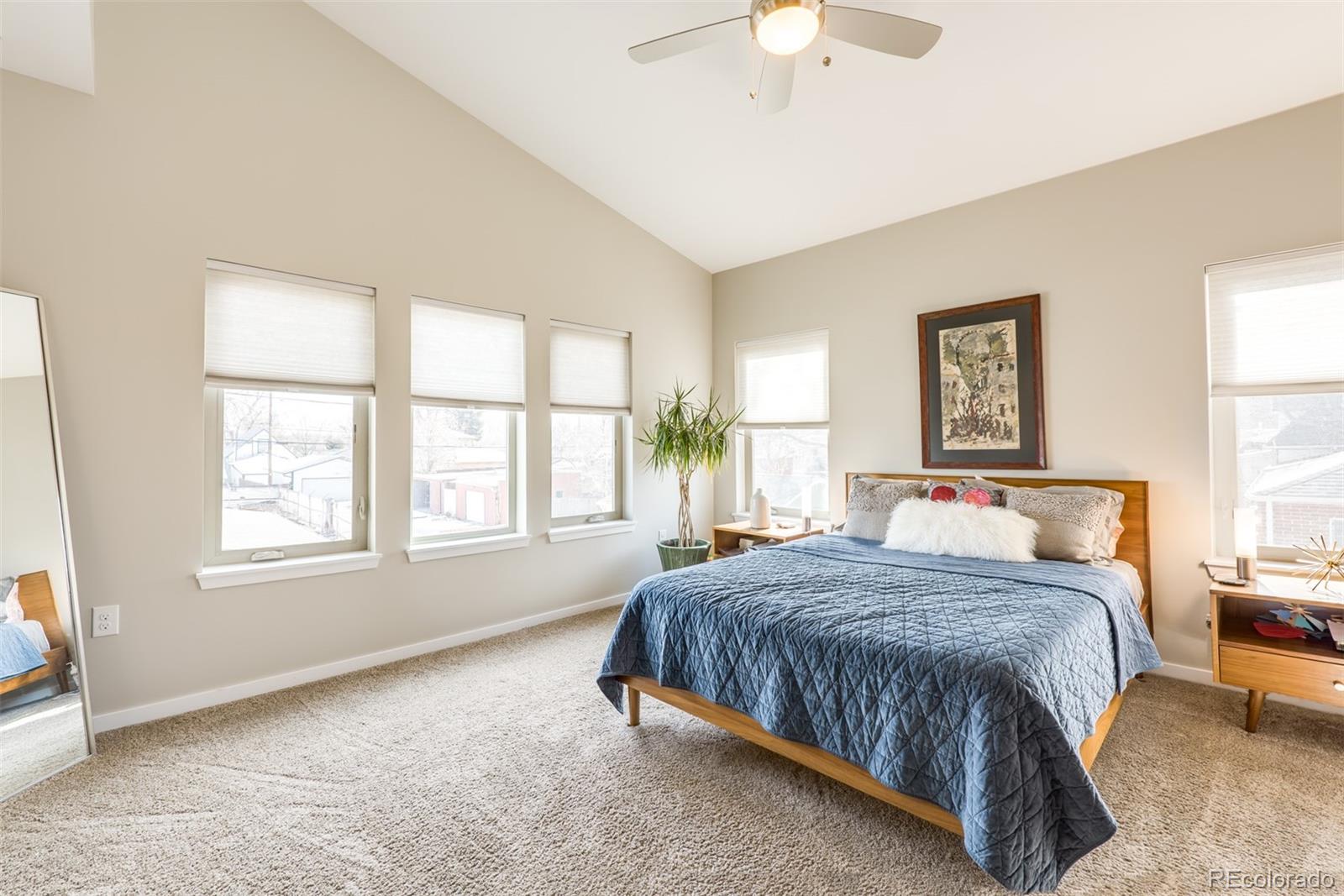 4030 Bryant Street Denver, CO 80211 - Photo 14 of 26 a bedroom with a large bed and a window