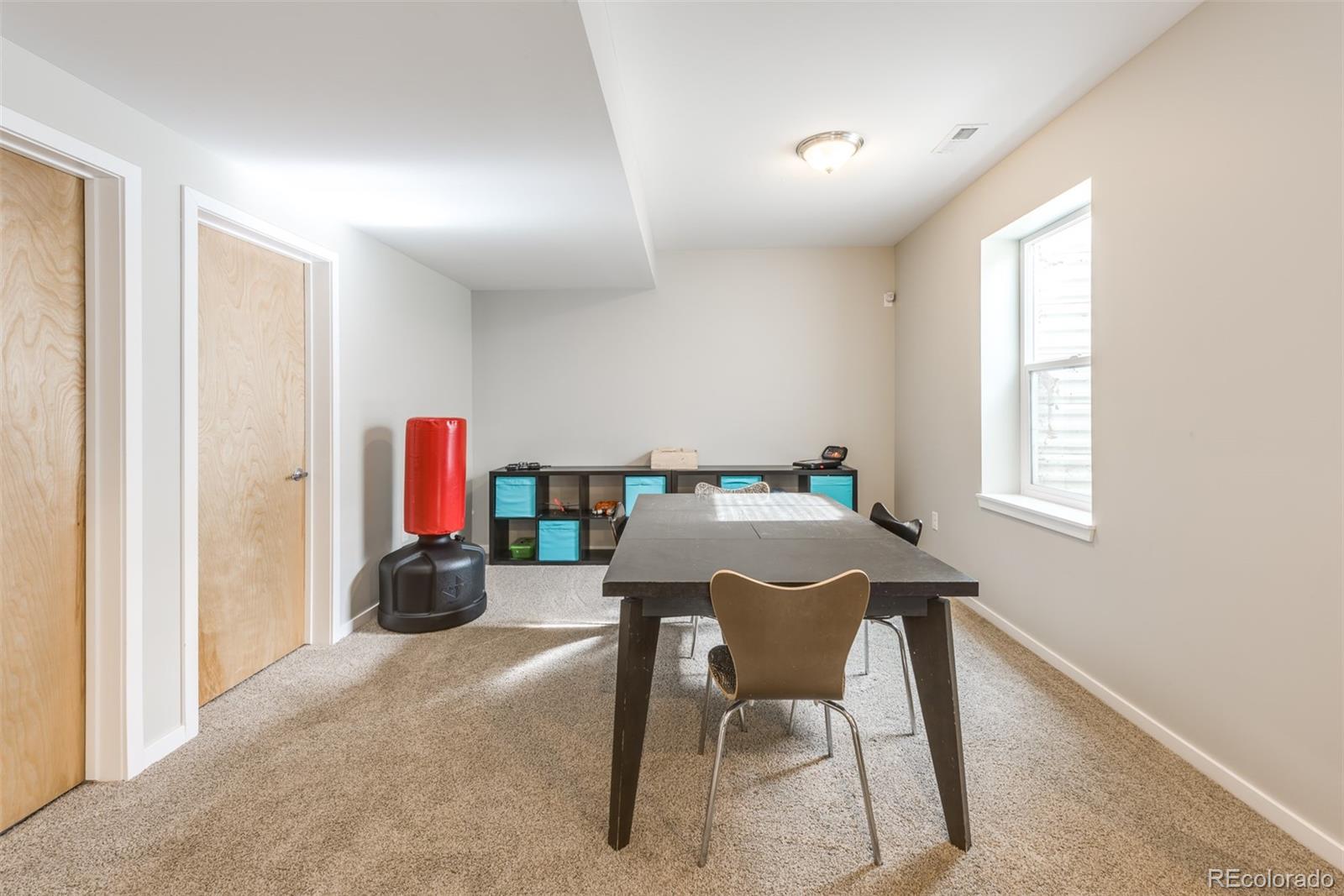4030 Bryant Street Denver, CO 80211 - Photo 20 of 26 a dining room with furniture and a window