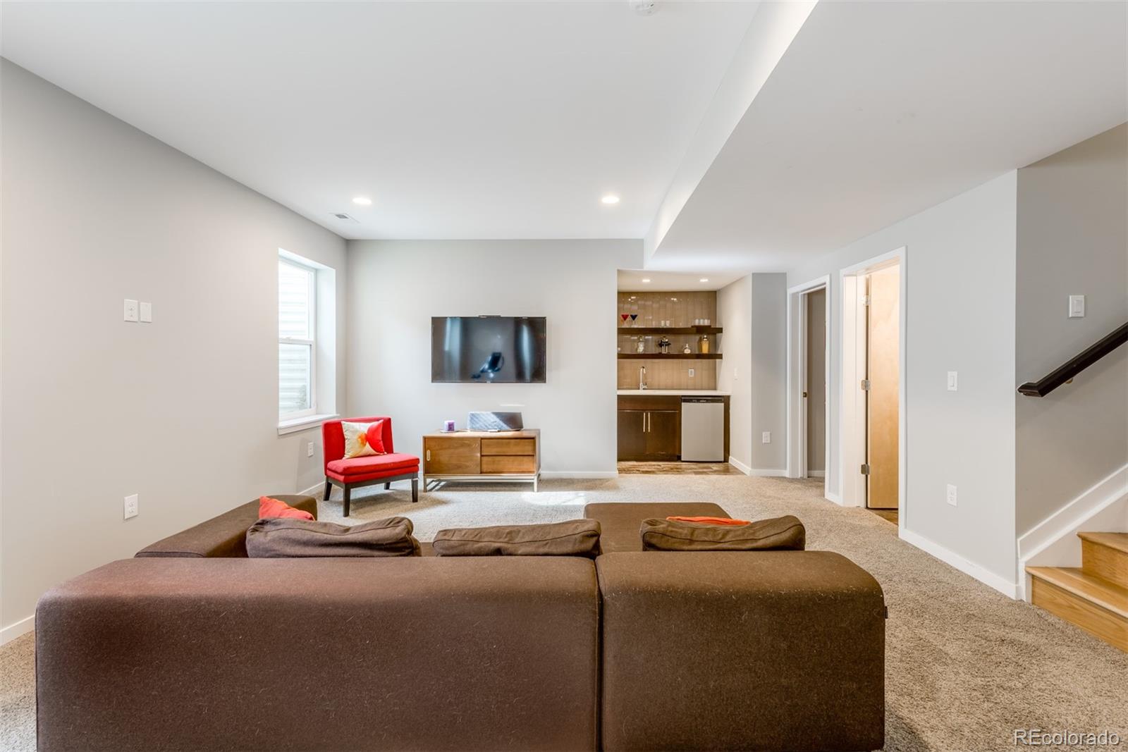 4030 Bryant Street Denver, CO 80211 - Photo 21 of 26 a bedroom with furniture and a flat screen tv