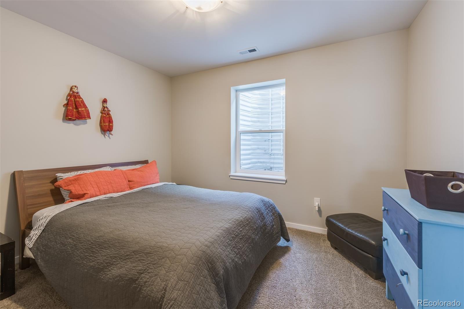 4030 Bryant Street Denver, CO 80211 - Photo 22 of 26 a bedroom with a bed and a window