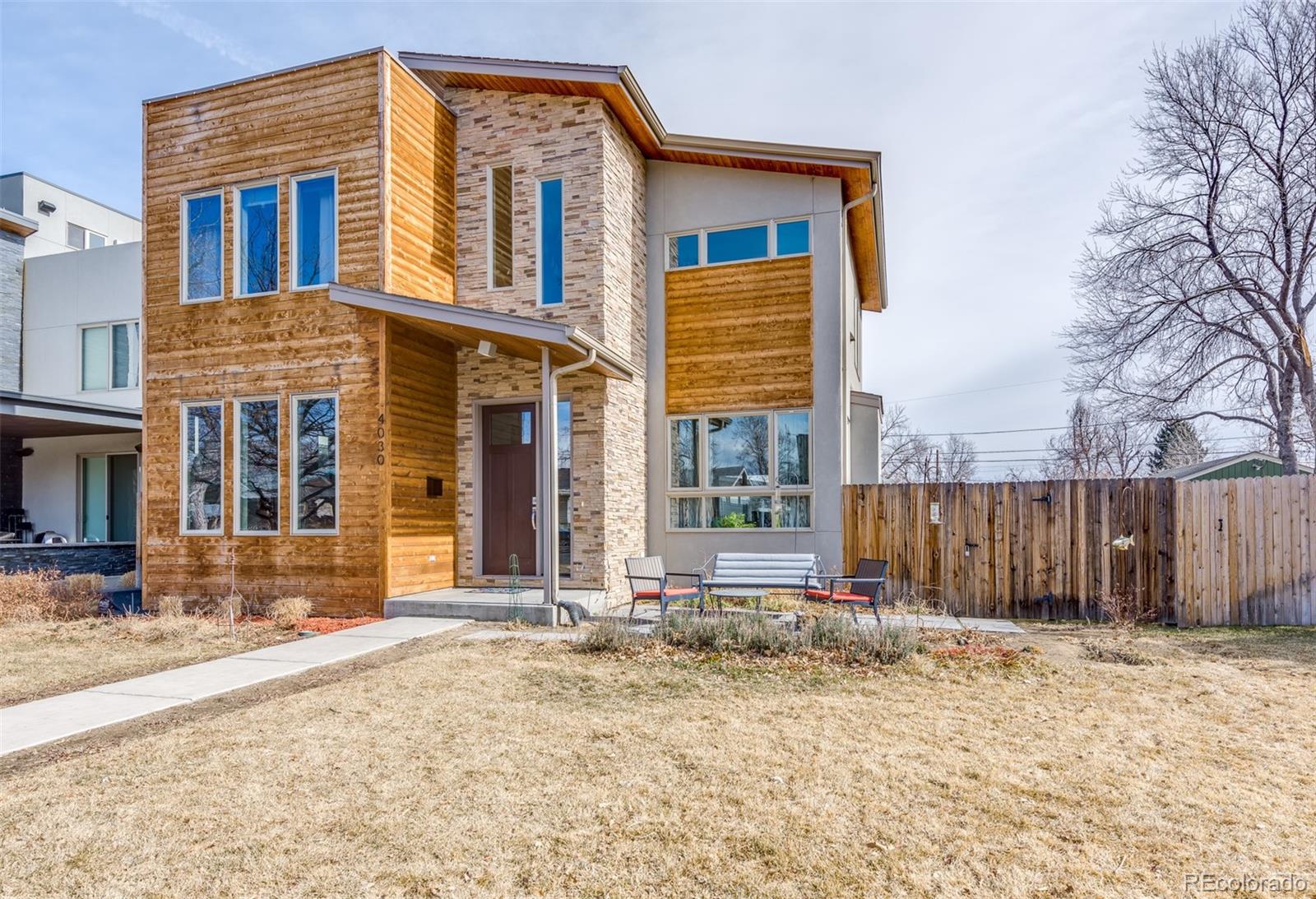 4030 Bryant Street Denver, CO 80211 - Photo 26 of 26 a front view of a house with a yard