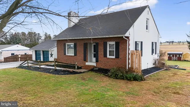 a view of a house with snow on the background