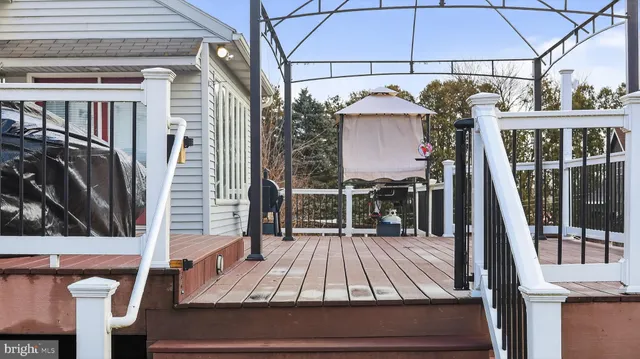 a view of outdoor space with wooden floor and deck