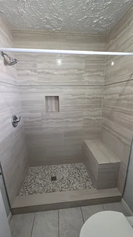 a room with a cabinets and washer