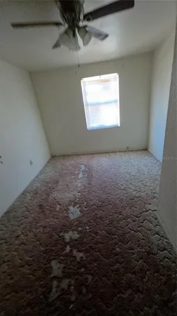 a view of an empty room and window