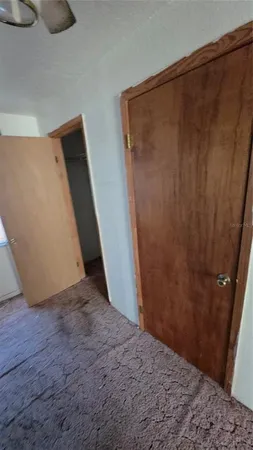 a kitchen with granite countertop a stove a sink and a microwave