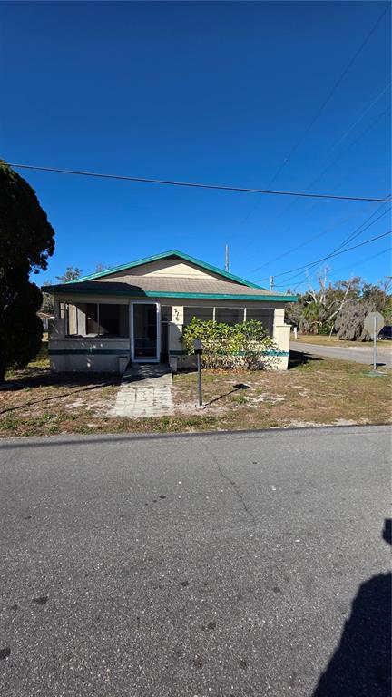 216 Northwest 4th Avenue Mulberry, FL 33860 - Photo 2 of 45 a view of a house with a yard
