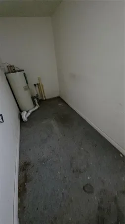 a view of a hallway with a toilet