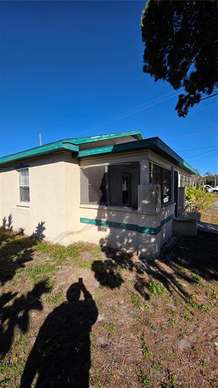 216 Northwest 4th Avenue Mulberry, FL 33860 - Photo 43 of 45 a front view of a house with a yard