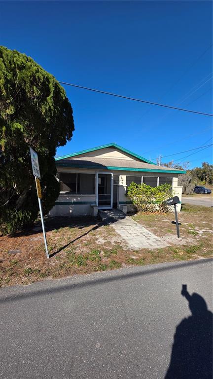 216 Northwest 4th Avenue Mulberry, FL 33860 - Photo 45 of 45 a view of a house with a yard and garage