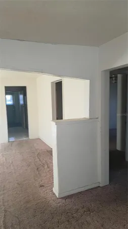 a view of an empty room and window