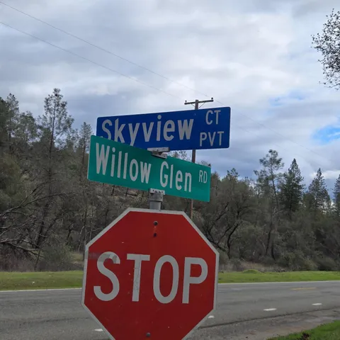 a view of a sign board with yard