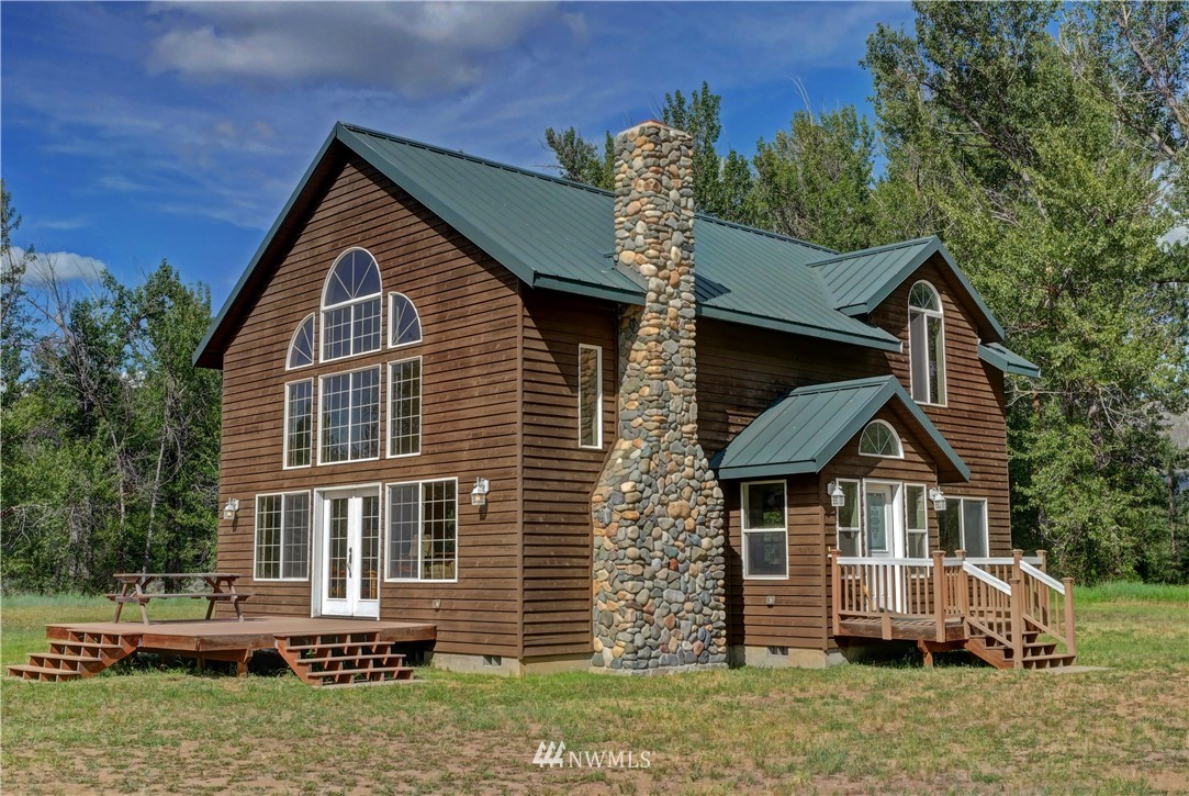 36 Beaver Pond Road Twisp, WA 98856 - Photo 2 of 40 a front view of a house with a yard