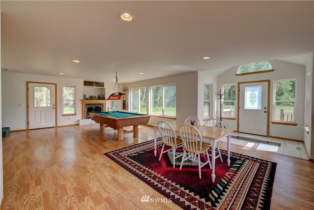 36 Beaver Pond Road Twisp, WA 98856 - Photo 15 of 40 a living room with furniture a wooden floor and next to a window