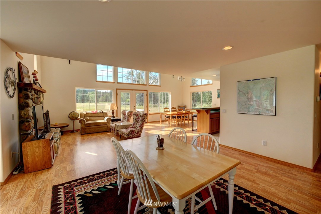 36 Beaver Pond Road Twisp, WA 98856 - Photo 16 of 40 a view of a dining room with furniture a chandelier and wooden floor