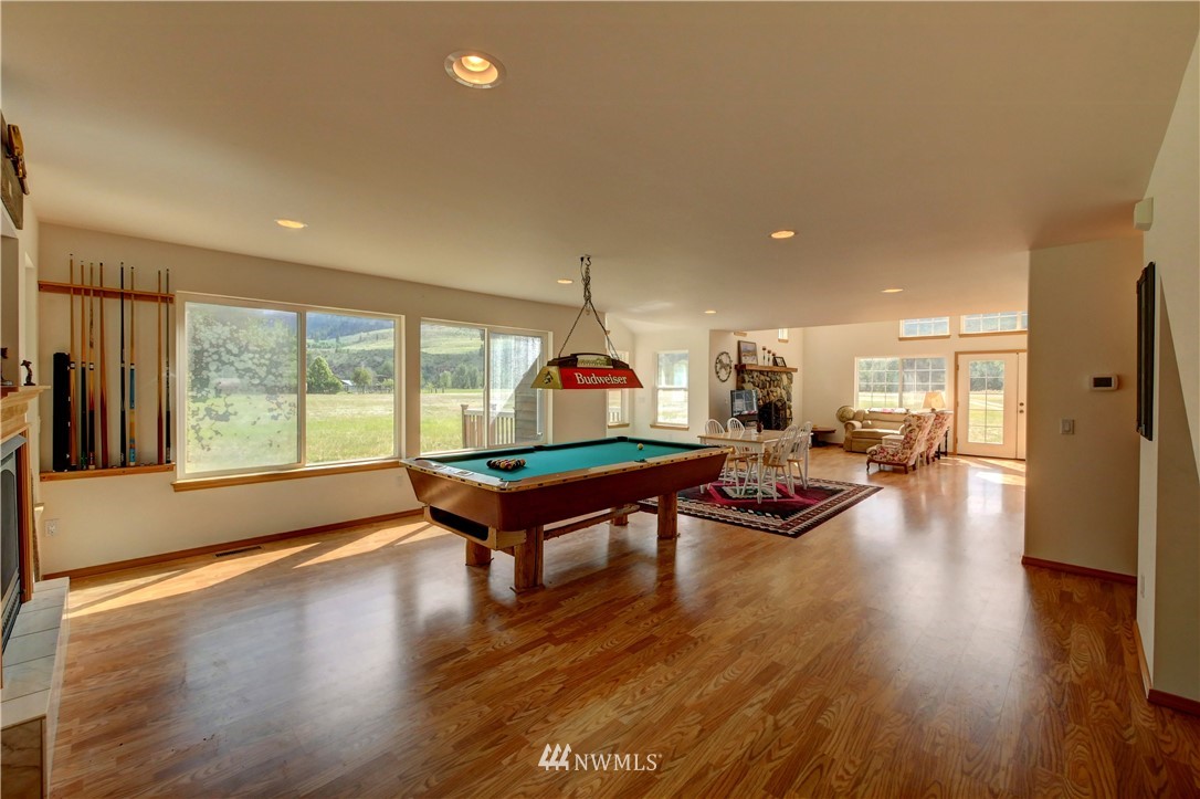 36 Beaver Pond Road Twisp, WA 98856 - Photo 17 of 40 a living room with furniture a table and wooden floor