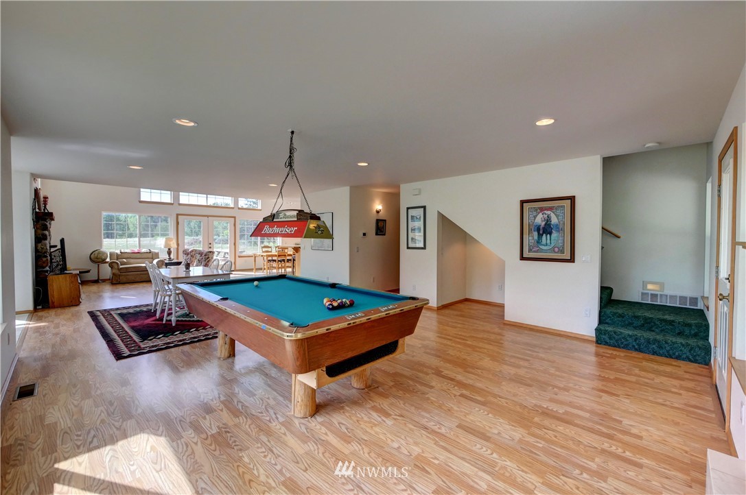 36 Beaver Pond Road Twisp, WA 98856 - Photo 18 of 40 a living room with furniture pool table and a wooden floor