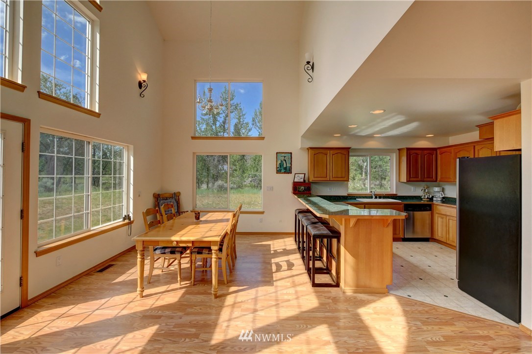 36 Beaver Pond Road Twisp, WA 98856 - Photo 20 of 40 a group of chairs sitting in a kitchen next to a window