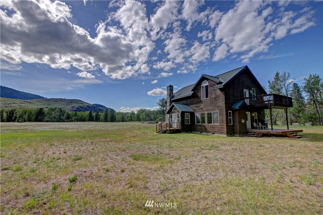 36 Beaver Pond Road Twisp, WA 98856 - Photo 3 of 40 a front view of a house with a yard